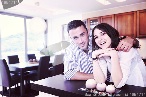 Image of happy young couple have fun in modern kitchen