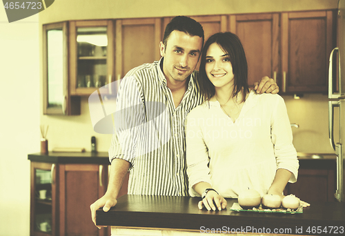 Image of happy young couple have fun in modern kitchen