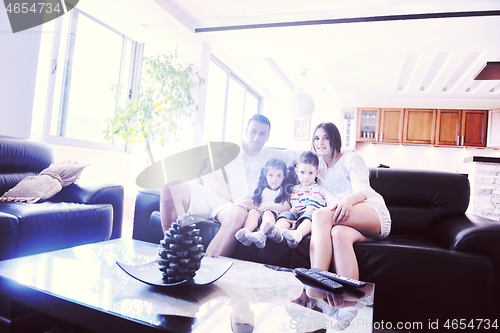 Image of young family at home