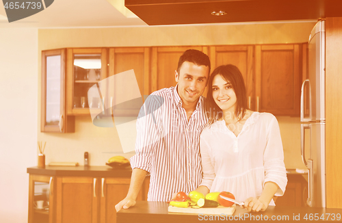 Image of happy young couple have fun in modern kitchen