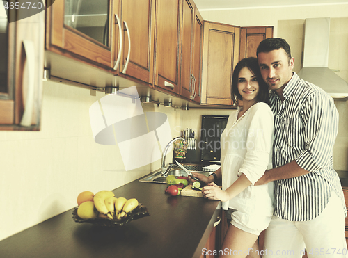 Image of happy young couple have fun in modern kitchen