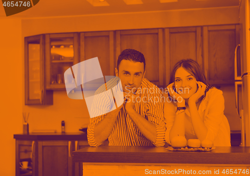 Image of happy young couple have fun in modern kitchen