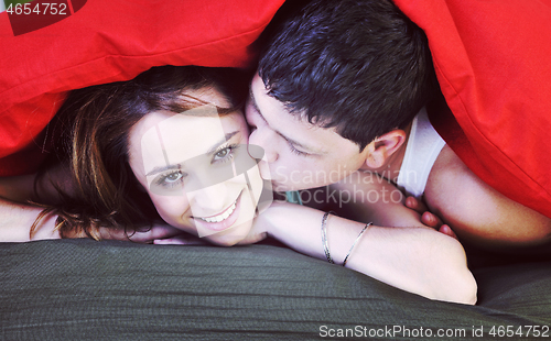 Image of young couple in bed