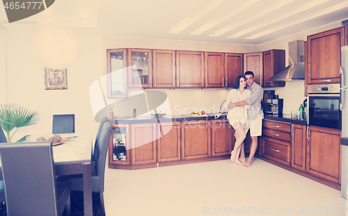 Image of happy young couple have fun in modern kitchen