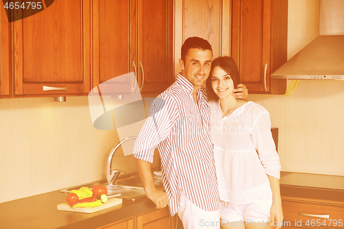 Image of happy young couple have fun in modern kitchen