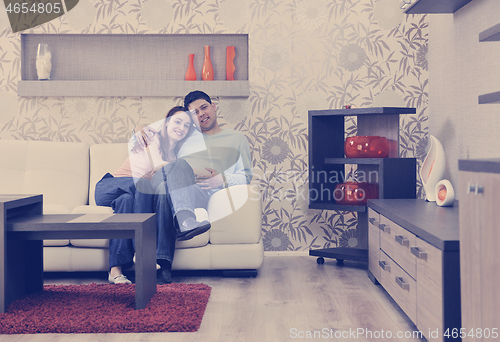 Image of couple relaxing at home