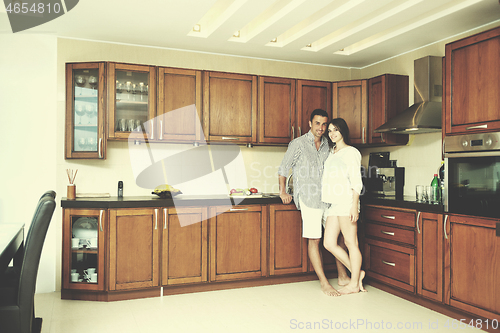 Image of happy young couple have fun in modern kitchen