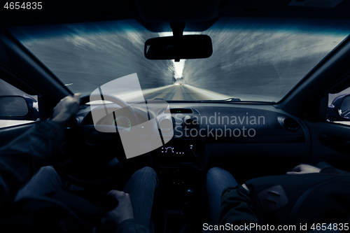 Image of driving a car on winter road