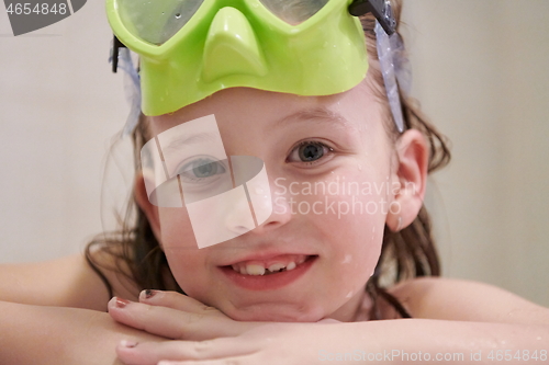 Image of little girl with snorkel goggles