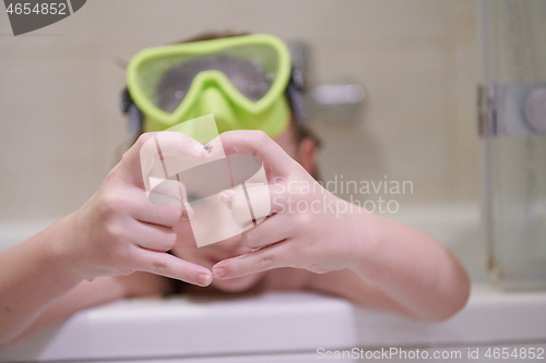 Image of little girl with snorkel goggles