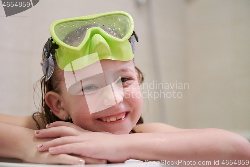 Image of little girl with snorkel goggles