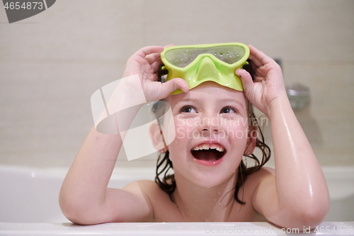 Image of little girl with snorkel goggles