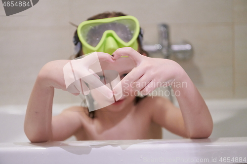 Image of little girl with snorkel goggles