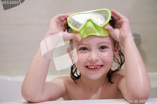 Image of little girl with snorkel goggles