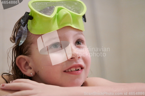 Image of little girl with snorkel goggles