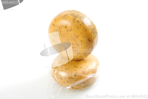 Image of Organic Cheese wheel isolated on white background.