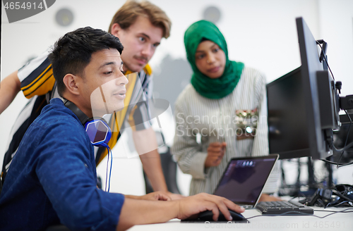 Image of Multiethnic startup business team with Arabian woman