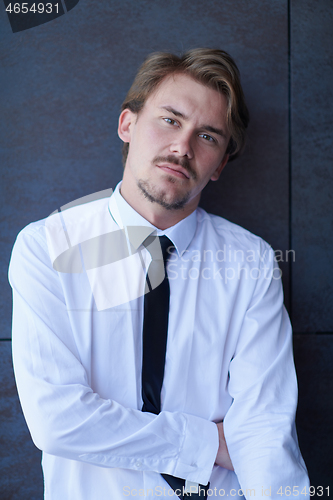 Image of portrait of startup businessman in a white shirt with a tie