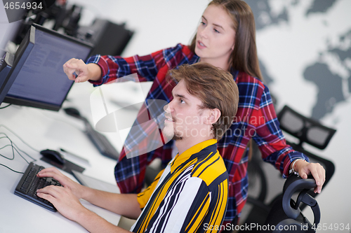 Image of business couple working together on project