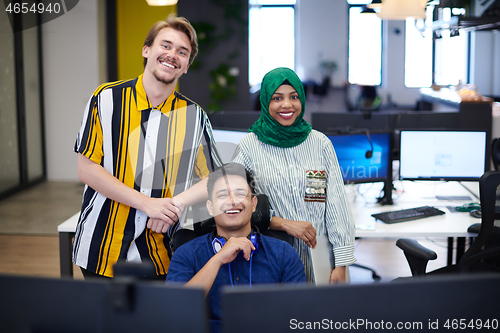 Image of Multiethnic startup business team with Arabian woman