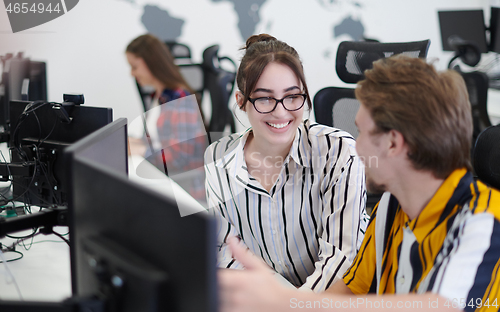 Image of business couple working together on project