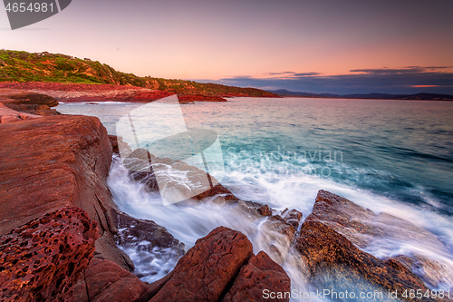 Image of Early morning on the rich red rocky coast of Eden