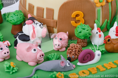 Image of birthday cake with farm marzipan animals
