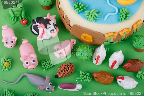 Image of birthday cake with farm marzipan animals