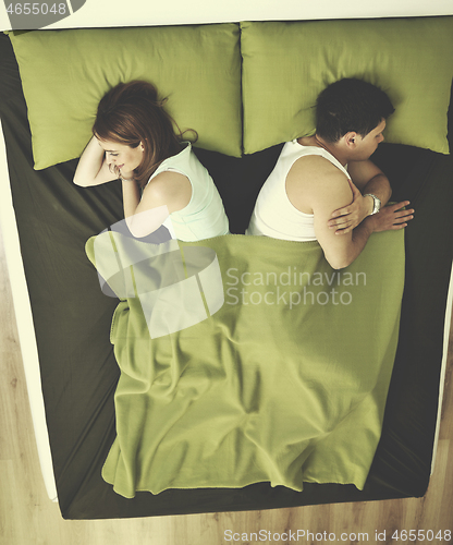 Image of young couple in bed