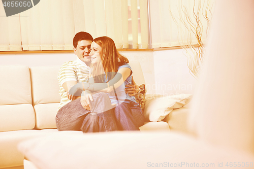 Image of couple relaxing at home