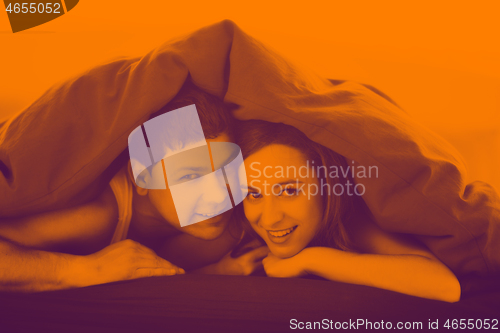 Image of young couple in bed