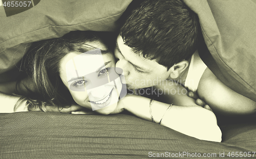 Image of young couple in bed