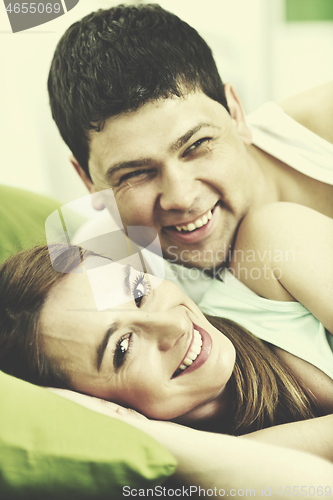 Image of young couple in bed