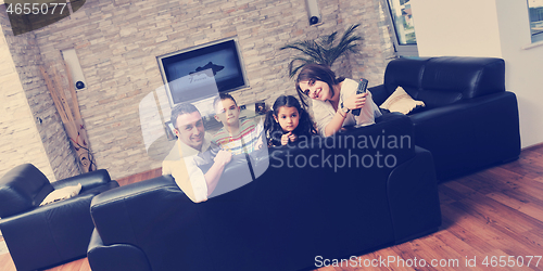 Image of young family at home