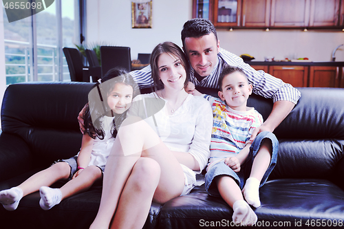 Image of young family at home