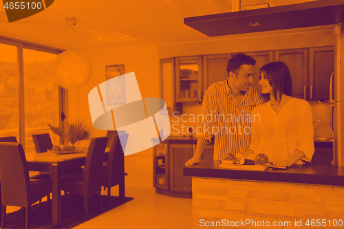 Image of happy young couple have fun in modern kitchen