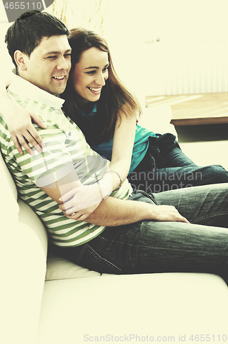 Image of couple relaxing at home