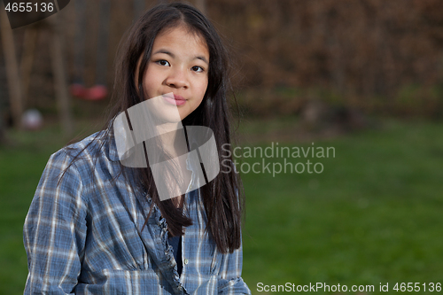 Image of Portrait of a young cute girl looking at the camera
