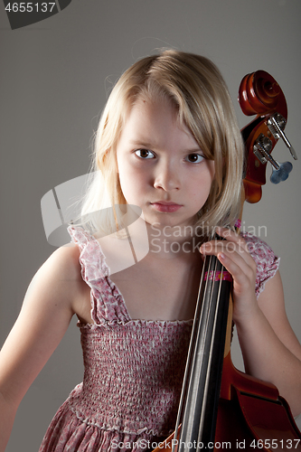 Image of Portrait of a young teenager girl in studio with a cello