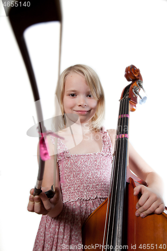 Image of Portrait of a young teenager girl in studio with a cello