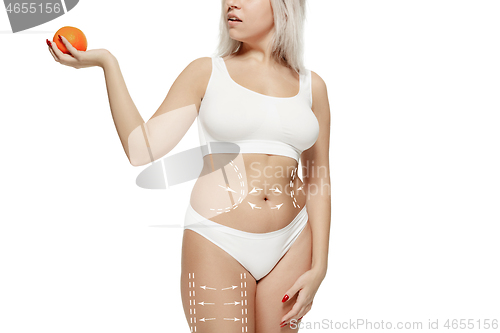 Image of Female body with the drawing arrows. Fat lose, liposuction and cellulite removal concept