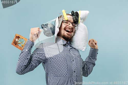 Image of Tired man sleeping at home having too much work. Bored businessman with pillow