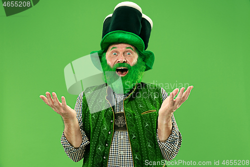 Image of A man in a leprechaun hat at studio. He celebrates St. Patrick\'s Day.