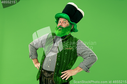 Image of A man in a leprechaun hat at studio. He celebrates St. Patrick\'s Day.