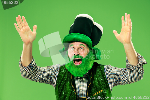 Image of A man in a leprechaun hat at studio. He celebrates St. Patrick\'s Day.