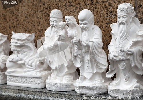 Image of SAIGON, VIETNAM - JANUARY 04, 2015 - Statuettes representing Buddhist deities