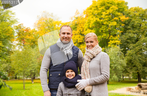 Image of happy family in autumn park