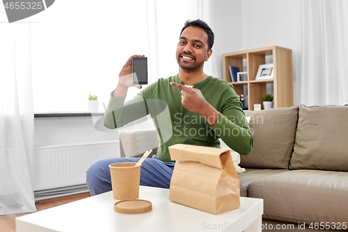 Image of indian man using smartphone for food delivery