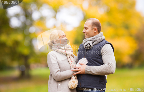 Image of smiling couple in autumn park