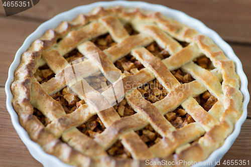 Image of close up of apple pie on wooden table